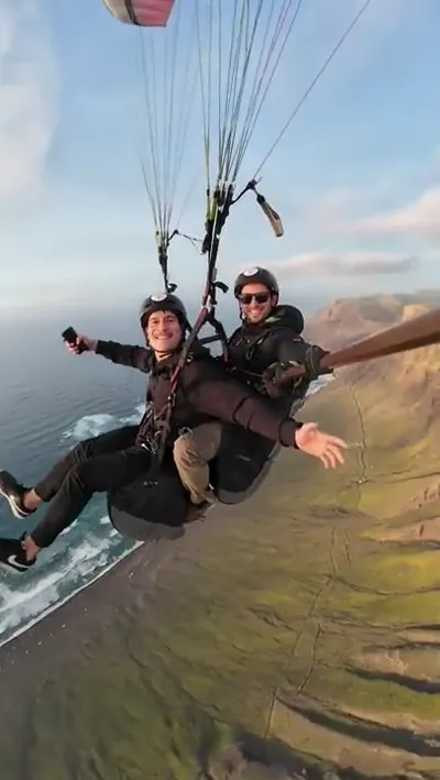 Sunset tandem paragliding flight over Famara cliffs, Lanzarote